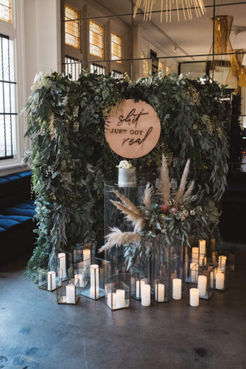 Greenery wall with black lanterns - On Trend Event Hire